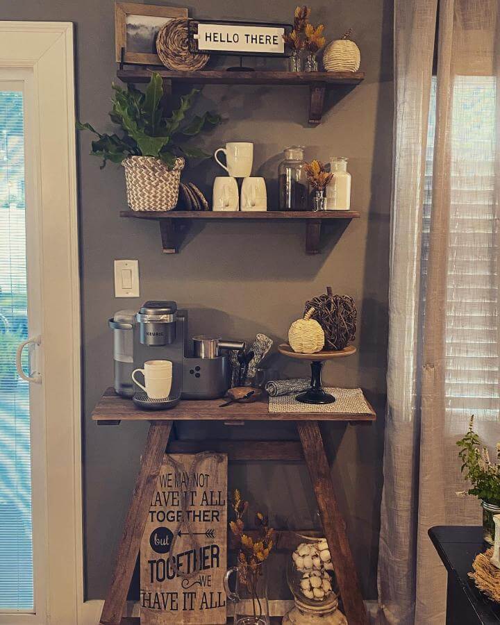 Rustic wood shelves coffee bar with baskets and mugs by @livin.leski.home. A cozy and natural coffee nook setup.