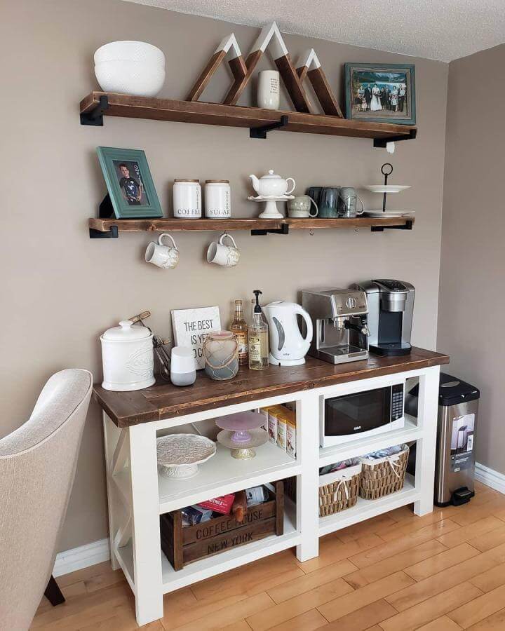 Rustic wood shelves with black brackets in a cozy coffee bar setup by @sarabethmakes featuring ceramic jars and warm wood tones for diy coffee bar ideas