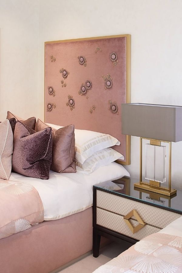 Elegant Luxe headboard featuring intricate embellishments and subtle blush accents.