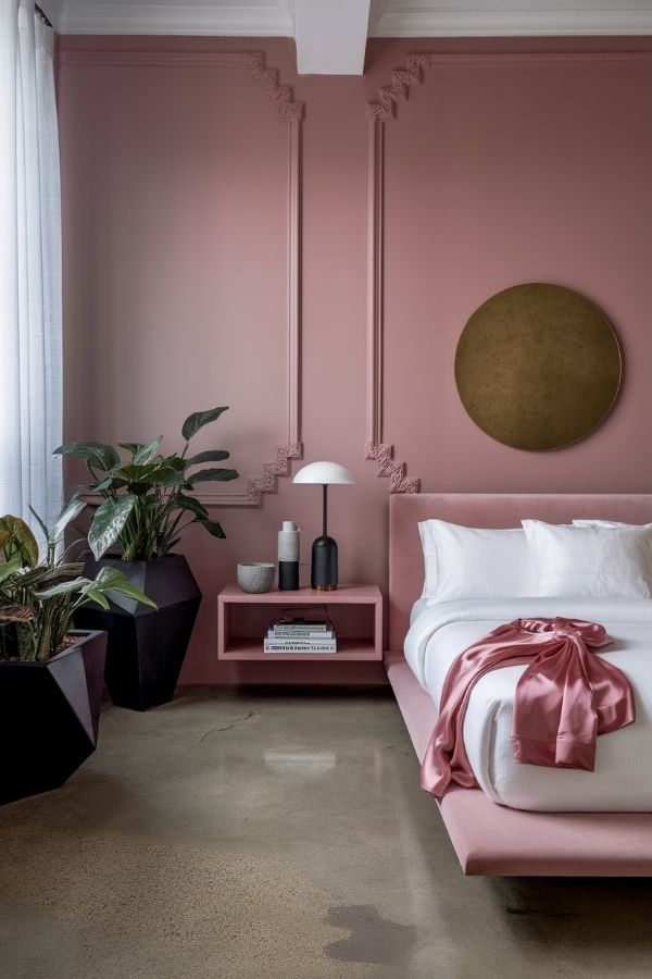 A modern pink design featuring sleek lines with gold accents.