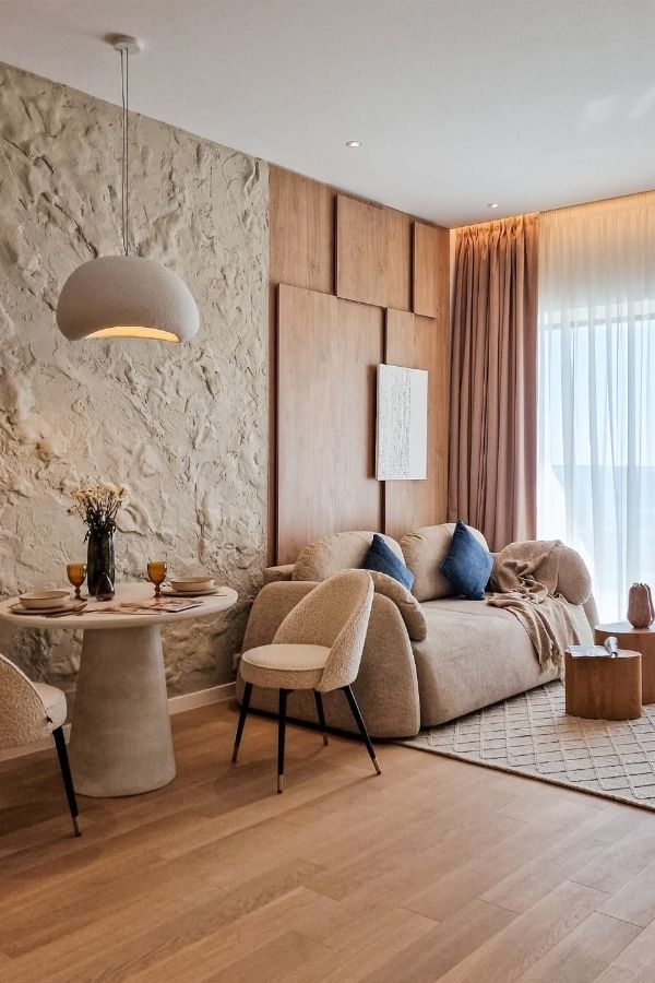 Warm cozy living room featuring textured walls and soft lighting.