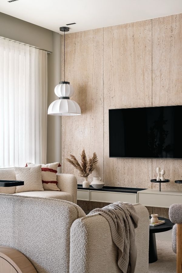 Elegant living room with textured walls, modern furniture, and decor.