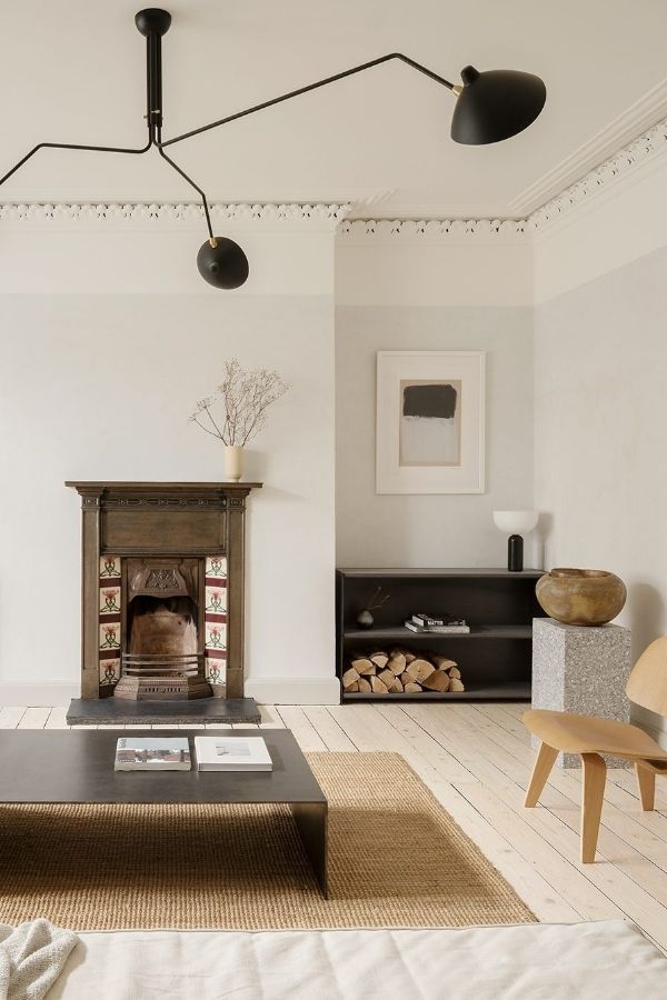 Minimalist living room, black accents, modern furniture, sleek design, elegance.