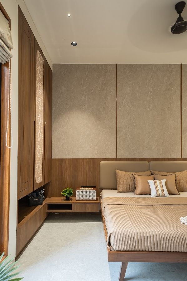 Cozy bedroom featuring wooden accents and soothing neutral color palette.