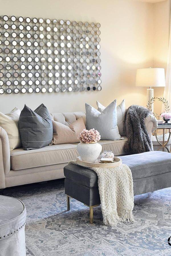 Chic mirrors enhance elegance, reflecting sophisticated style in elegant living room ideas.