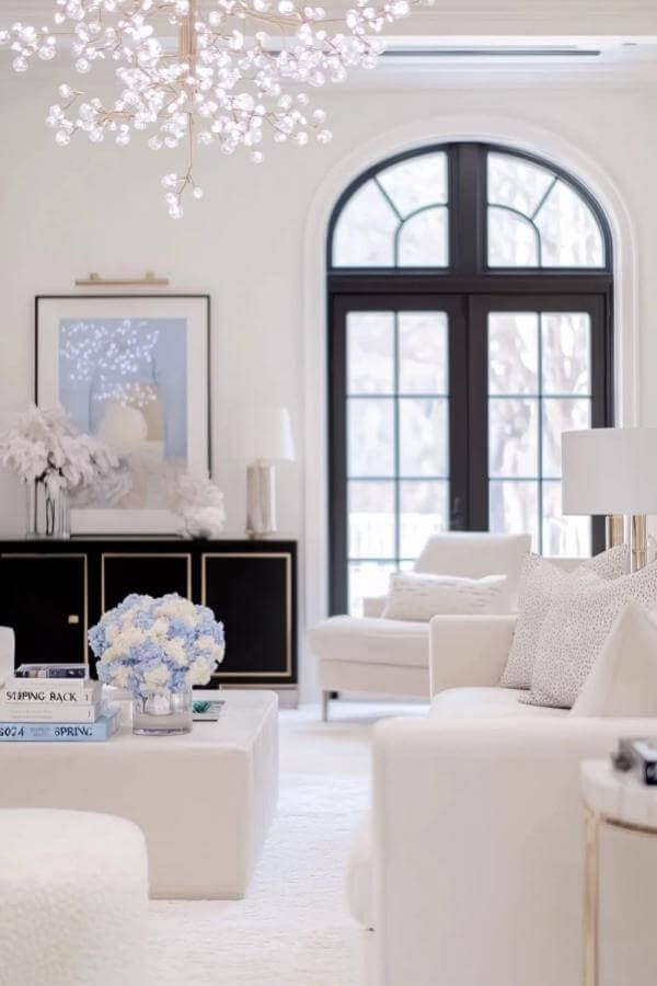 Radiant chandelier enhances plush serenity in elegant living room ideas.