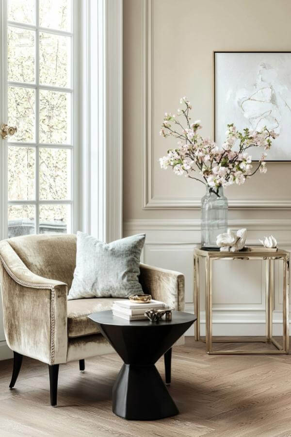 Luxurious velvet sofa enhances elegant living room ideas with charm.