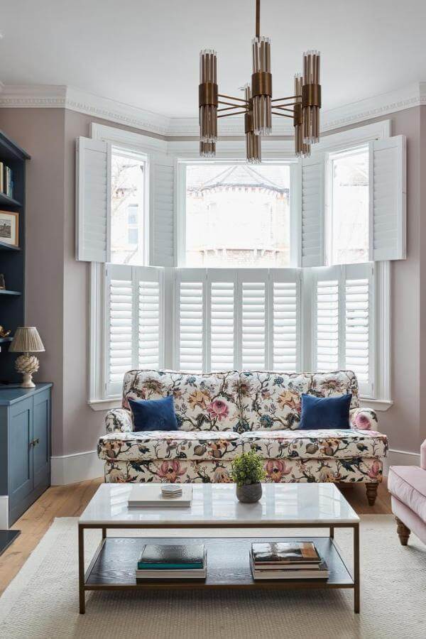 Elegant living room ideas: Chic florals, timeless shutters, sophisticated charm.