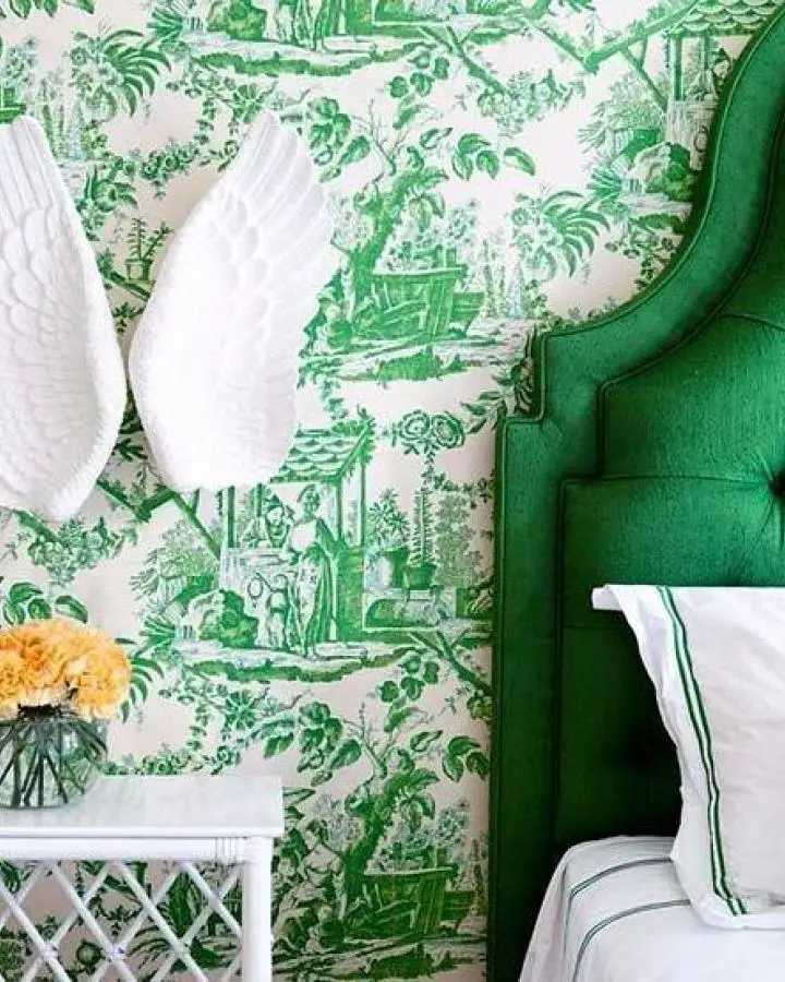 Emerald velvet headboard from @highly_sprung_furniture with matching green toile wallpaper in bedroom setting.