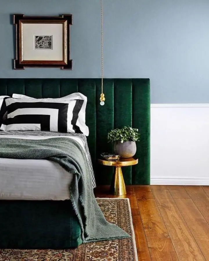 Luxurious emerald velvet headboard from @lamudi_ph. Features vertical channel tufting and rich jewel tone coloring.