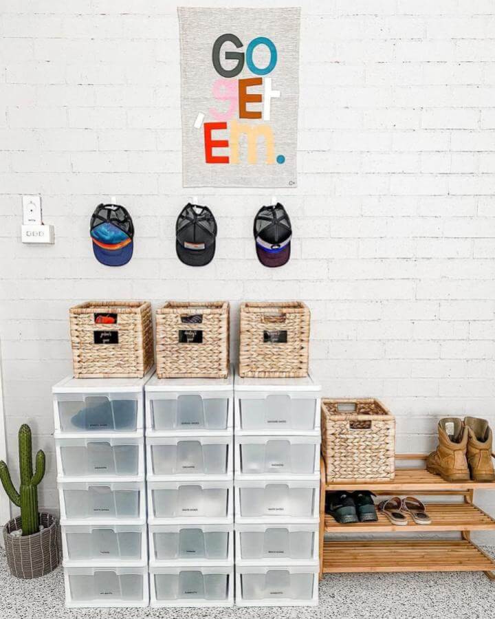 Natural woven baskets and clear plastic drawers organize shoes stylishly with a wooden rack nearby in a home entryway.