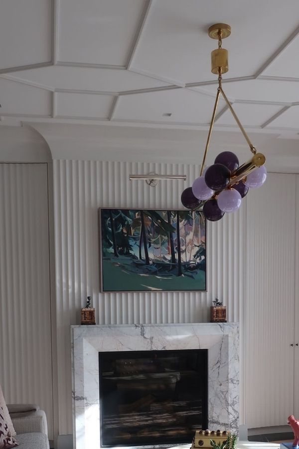 Stylish living room featuring a modern fluted fireplace and decor.