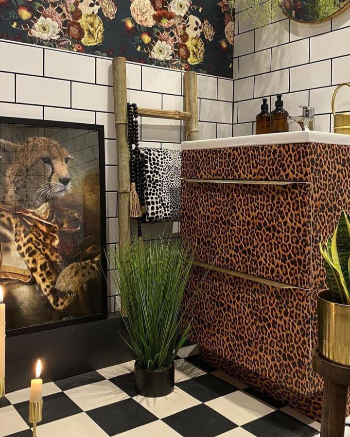 Leopard print vanity with checkerboard floor and floral wallpaper in funky bathroom ideas from @get.kooky vibrant and eclectic style