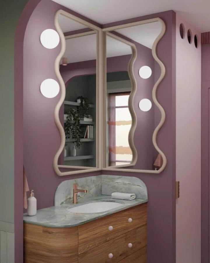 Wavy framed mirrors with round lights in a purple bathroom by @wojtyczka.pracowniaprojektowa funky bathroom ideas quirky elegant vibe