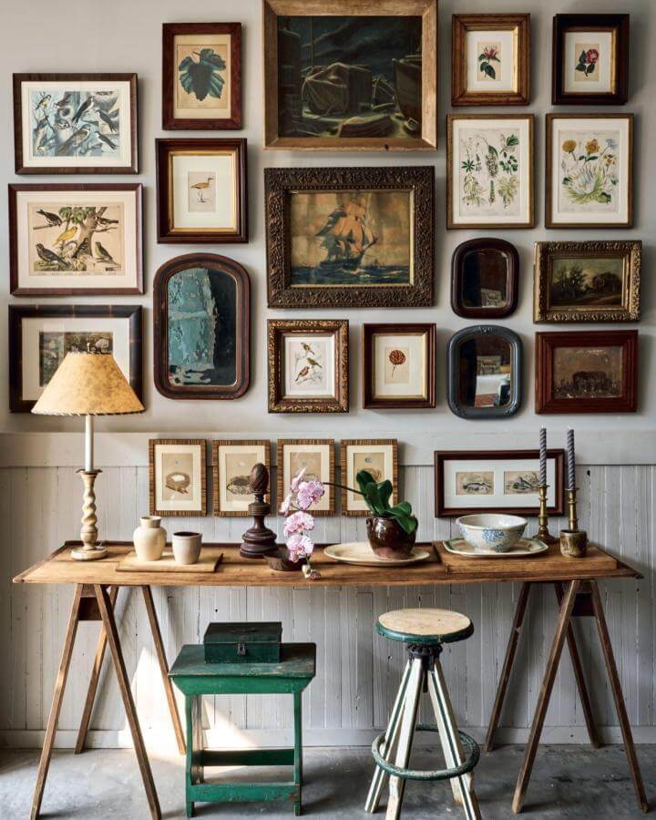 Vintage gallery wall ideas with wood frames, botanical prints, and antique mirrors from @kabinettandkammer. Cozy eclectic decor.