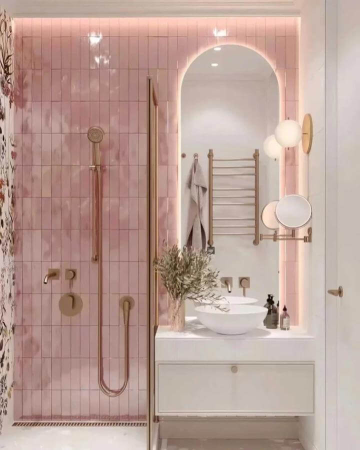 Blush pink tiled shower with gold fixtures and white vanity from @rbrohantofficial perfect for girly bathroom ideas. Soft, elegant lighting.