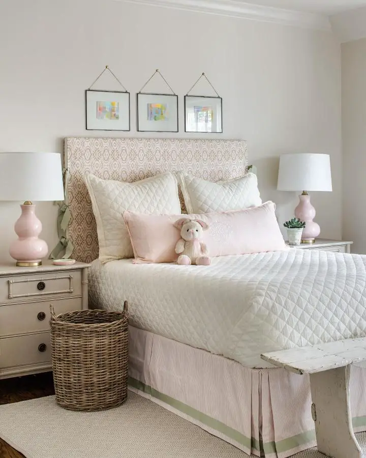 Soft pink ceramic table lamps from @ashleygilbreathinteriordesign showcasing elegant girly bedroom ideas for women with neutral bedding.