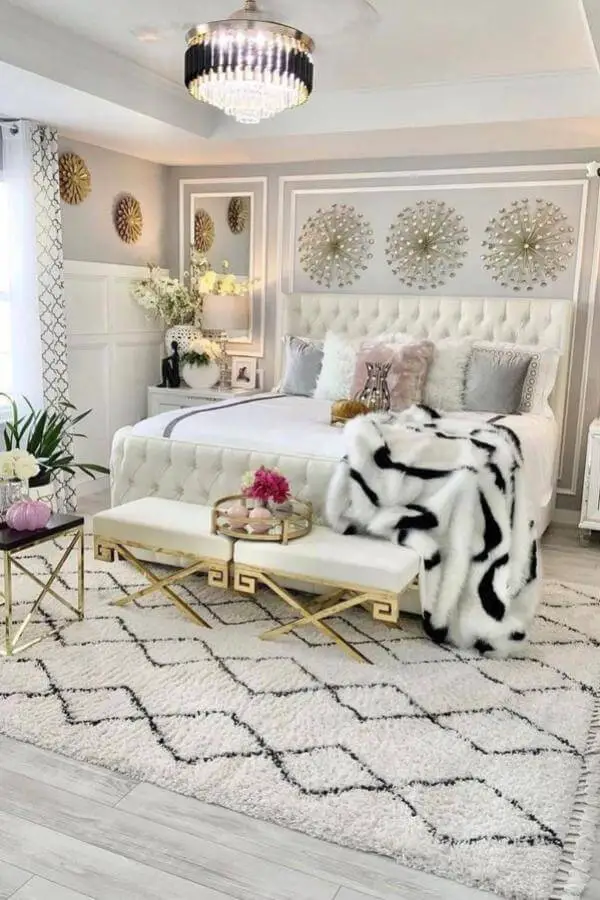 Luxurious white bedroom with crystal chandelier from @lea.home.decor showcasing glam bedroom decor with tufted headboard.