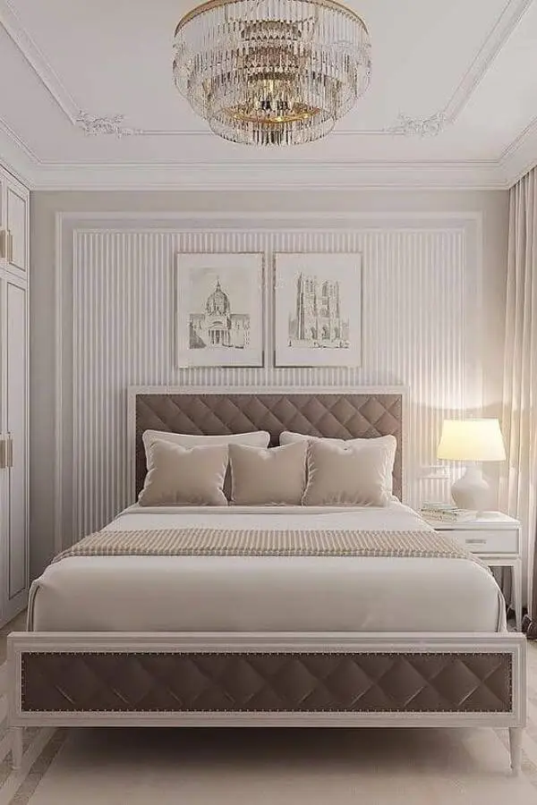Luxurious crystal chandelier bedroom with quilted headboard showcasing sophisticated glam bedroom decor from @vaneshomedecor.
