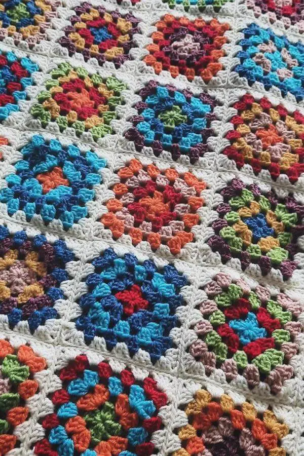 Colorful hexagonal crochet blanket from @my.anne.creations showcasing vibrant granny squares perfect for grandmacore aesthetic decor.