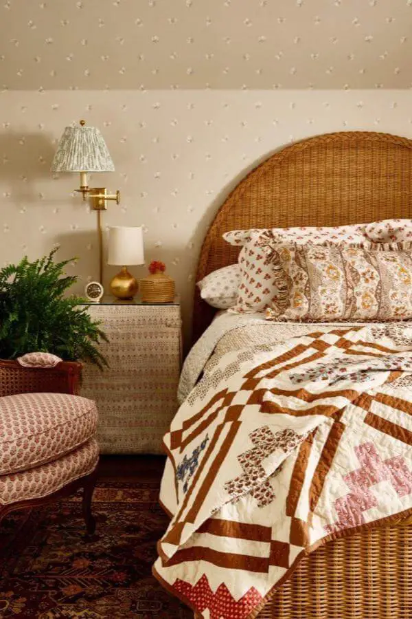 Geometric patterned quilt from @katierosenfeld. Perfect example of cozy grandmacore bedroom ideas with handmade textiles.