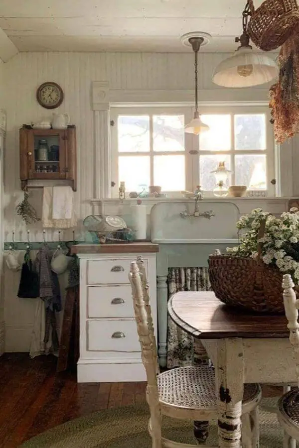 Vintage white farm sink from Bryarton Farm showcasing classic grandmacore kitchen ideas with exposed plumbing and natural lighting.