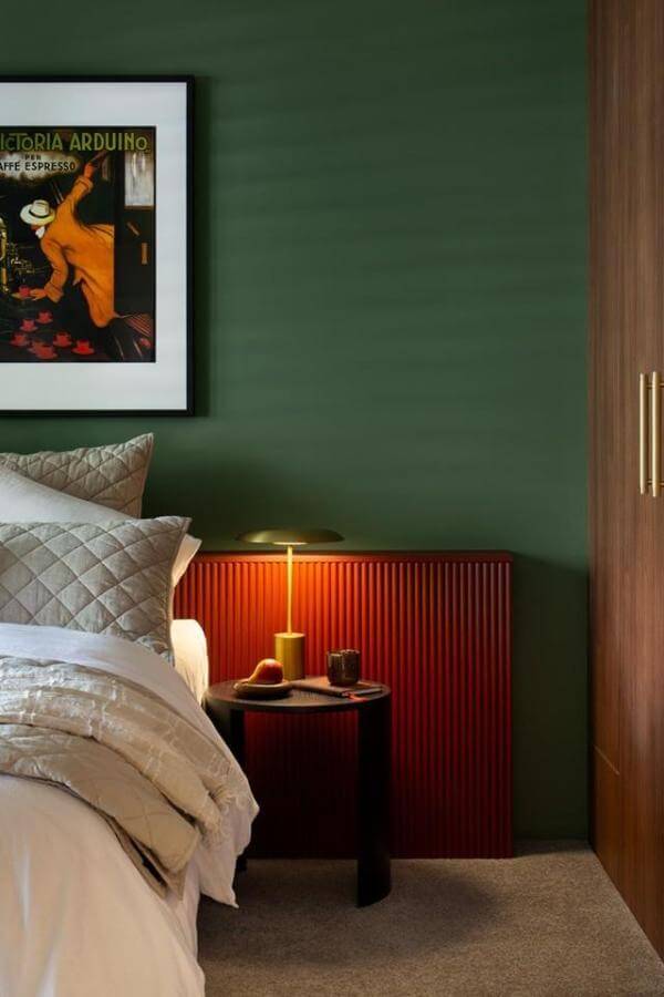 Warm terracotta panel headboard from @thestylesmiths_. Perfect for cozy green and terracotta bedroom ideas.