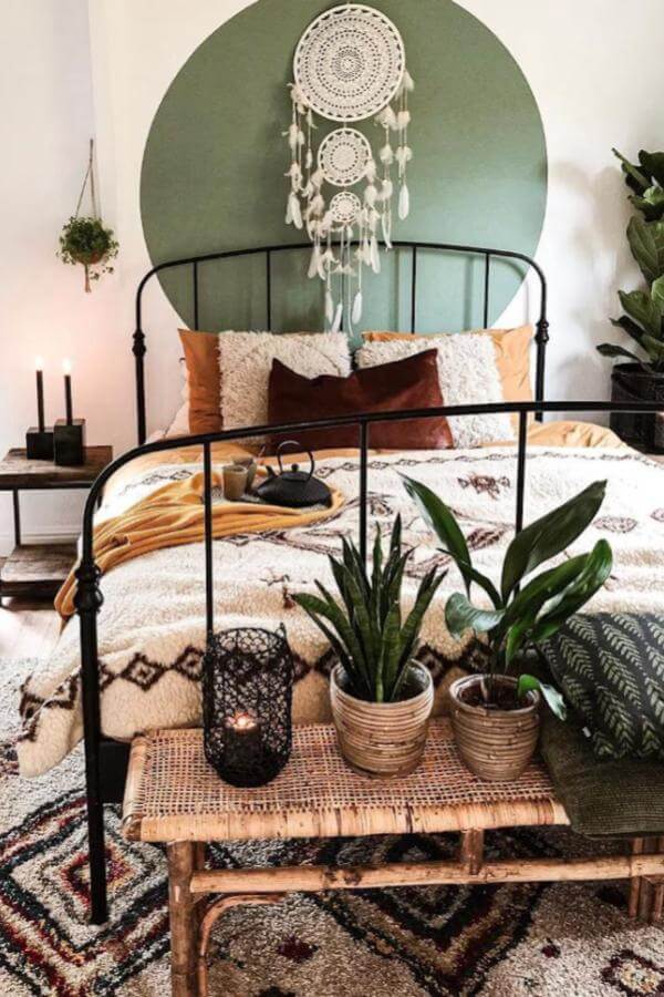 Boho green and terracotta bedroom with dreamcatcher and cozy textiles from @andrea_groot. Relaxing retreat vibe.