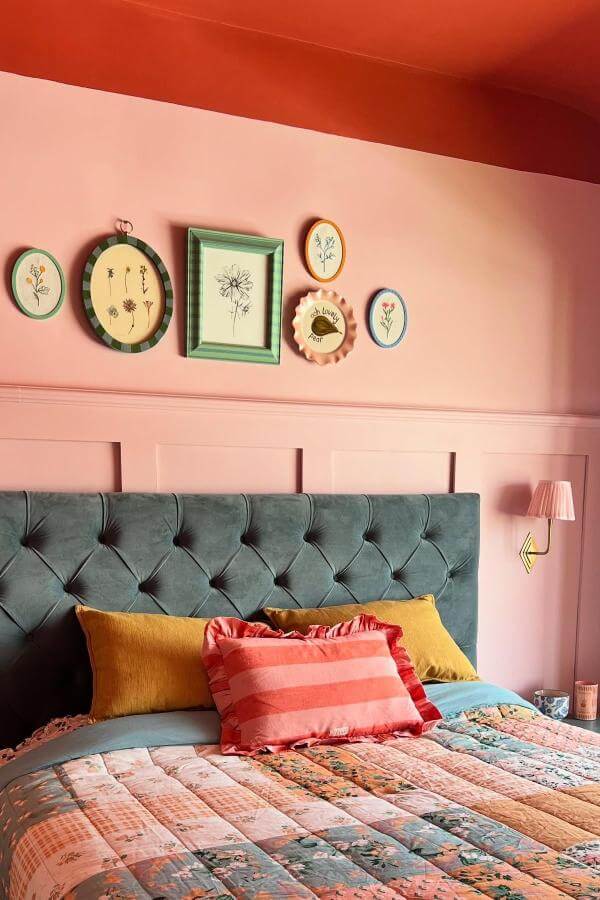 Playful gallery wall with soft pink backdrop from @homeofcharl inspired by green and terracotta bedroom ideas.