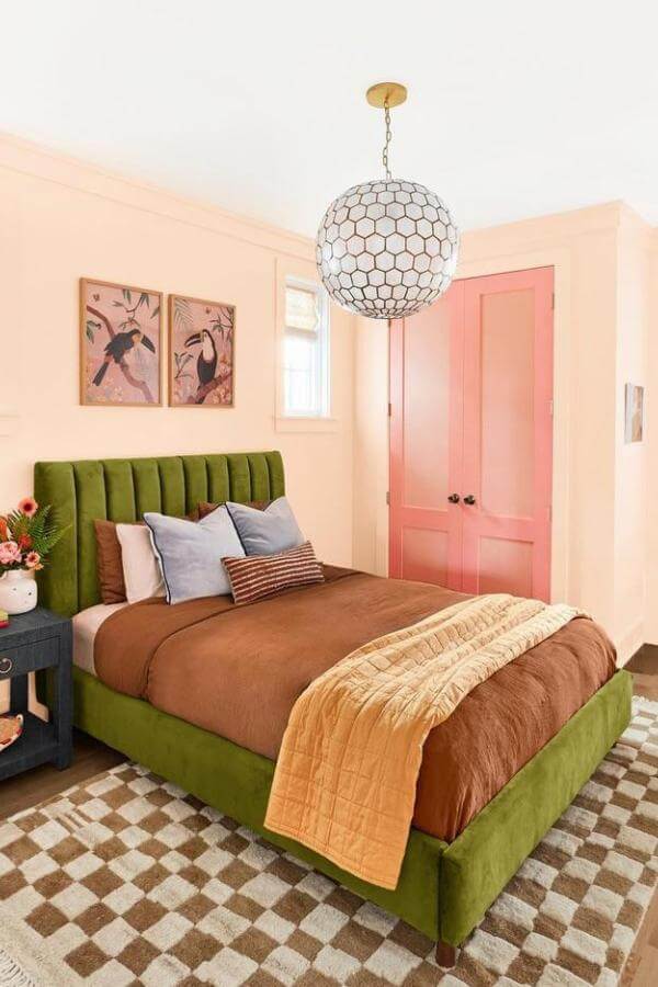 Olive velvet bed frame from @sunnycirclestudio. Bold centerpiece for stylish green and terracotta bedroom ideas.