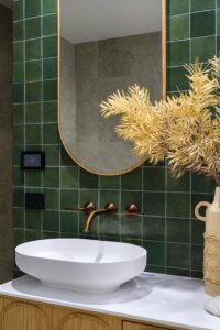 Emerald Green Bathroom with Bronze Faucet, a chic green bathroom idea.