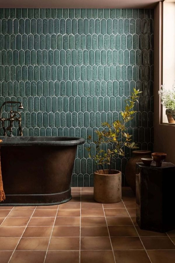 Arched tile pattern enhances elegant deep green bathroom ideas design.