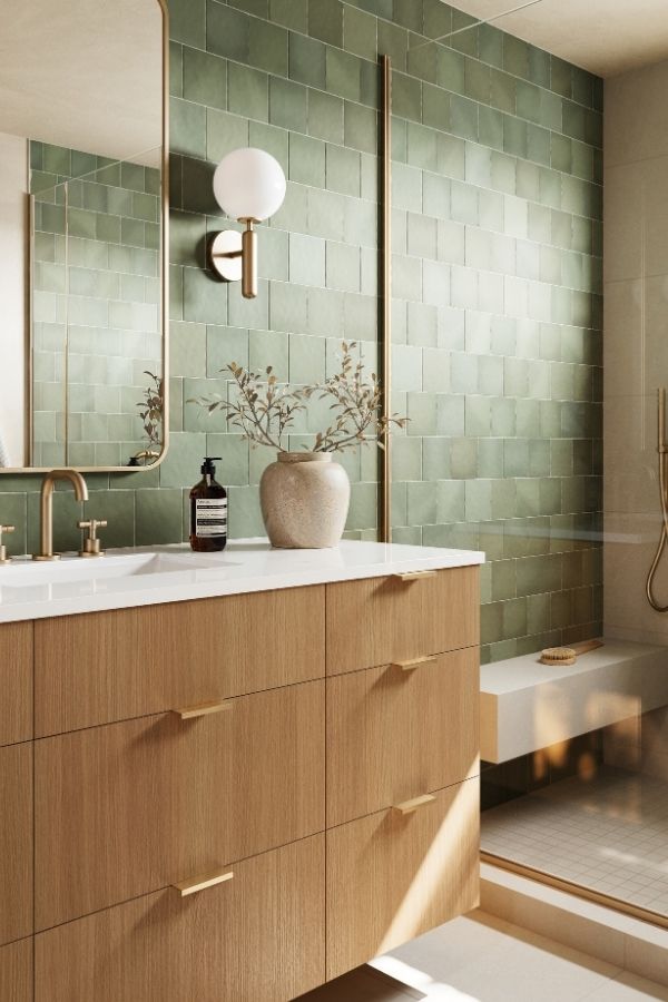 Elegant green bathroom, brass fixtures, modern design; green bathroom ideas.