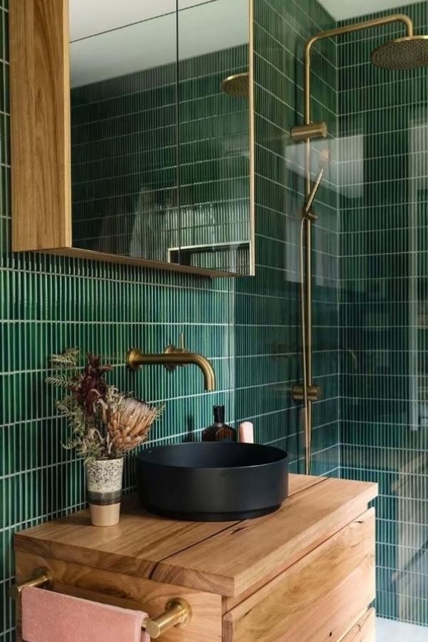 Refreshing green bathroom with vertical tile texture, inspiring green bathroom ideas.