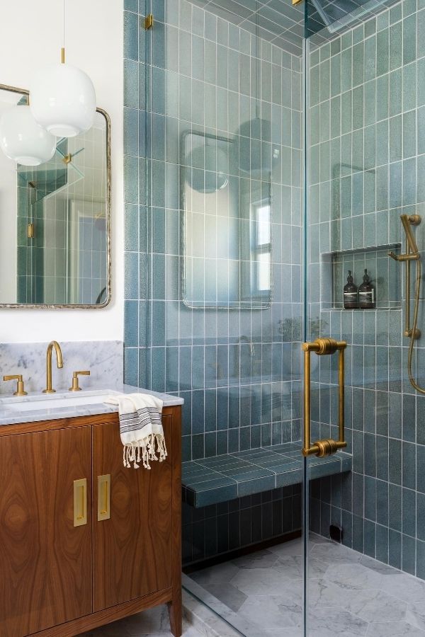 Green bathroom oasis, marble vanity top, lush greenery, green bathroom ideas.