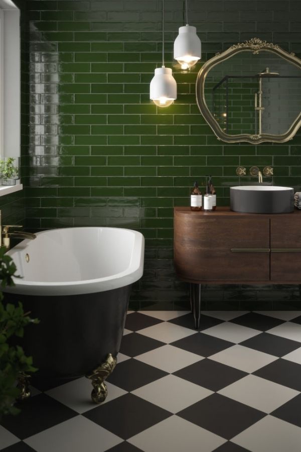 Vintage charm in green bathroom with ornate mirror, inspiring green bathroom ideas.