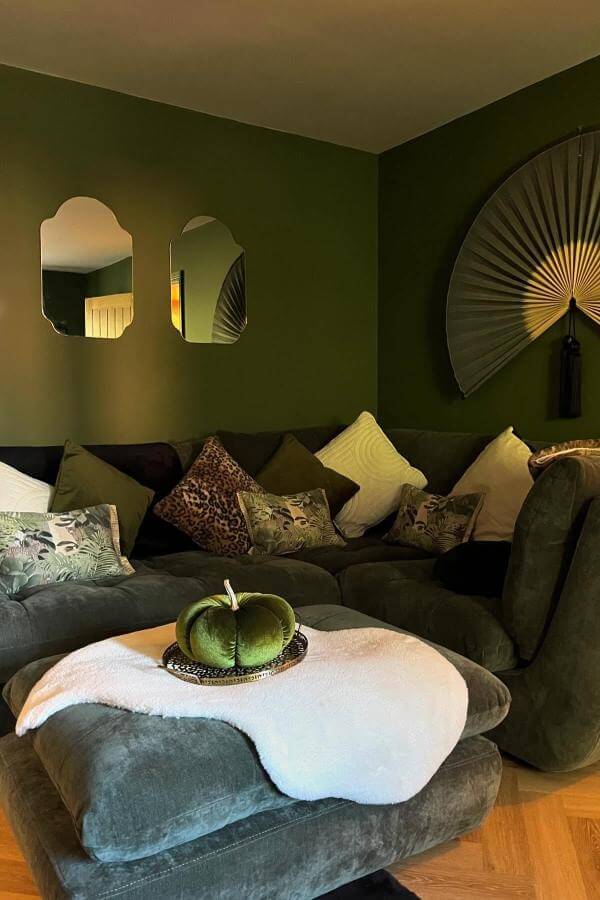 Statement Wall Fan from @natashalouisehome adds bold texture and drama, inspiring stylish green living room ideas.