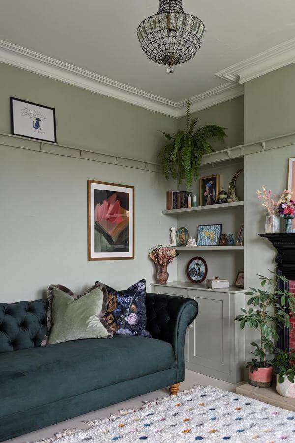 Plush velvet sofa from @oak_furniture_land adds cozy charm to sage walls in stylish green living room inspiration.