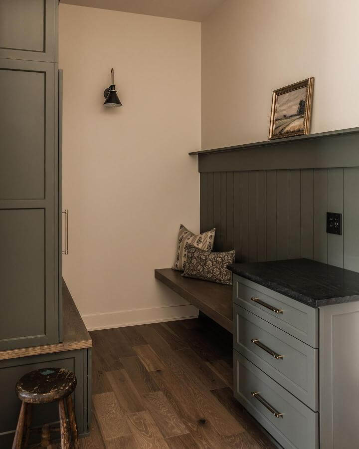 Olive green built-in bench and cabinetry with wood floor from @brookepavel featuring rustic and modern elements.