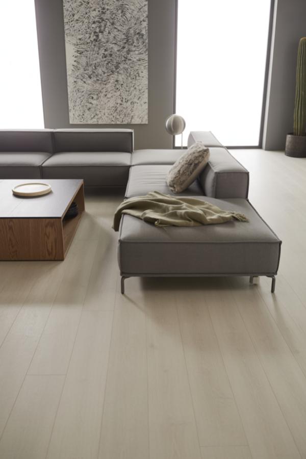 Modern sectional sofa with walnut coffee table showcasing grey minimalist living room ideas. Clean lines and neutral tones create serene space.