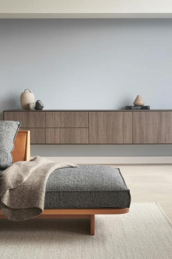 Modern floating wood credenza showcasing grey minimalist living room ideas with clean horizontal lines and neutral tones.