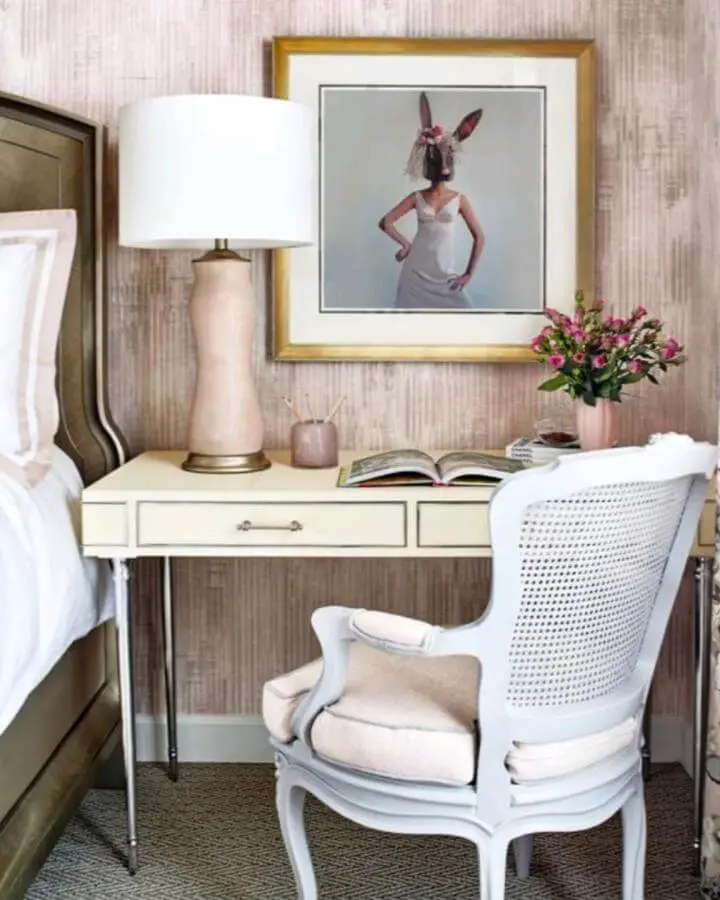 Whimsical framed artwork and cream desk setup from @pamelaharveyinteriors showcasing grown woman bedroom ideas with playful sophistication.