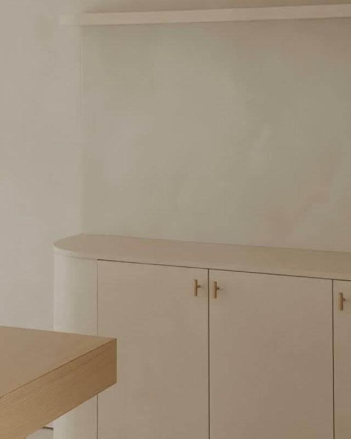 matte beige minimalist cabinet furniture from @house.ndl with rounded edges and brass handles in Japandi style ideas
