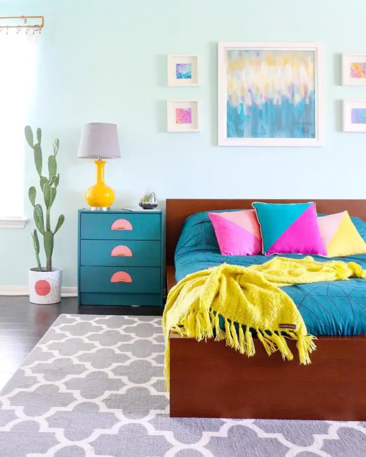 Colorful teal nightstand with pink handles showcasing creative ikea bedroom hacks from @kailochic bedroom design.