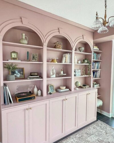 soft pink wood built-in arched Ikea Billy bookcase hacks & ideas from @allstylelife with decorative vintage and modern accents