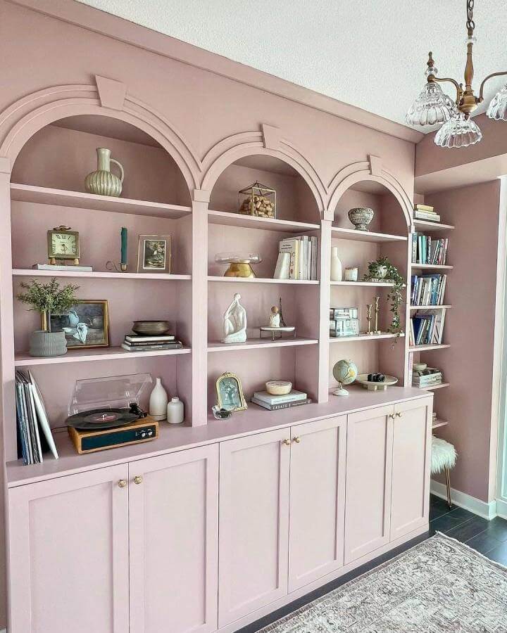 soft pink wood built-in arched Ikea Billy bookcase hacks & ideas from @allstylelife with decorative vintage and modern accents
