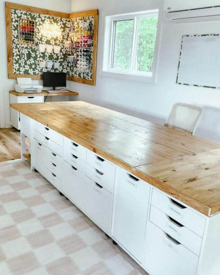 White and wood craft table with storage drawers and floral bulletin board ikea craft table hacks family handyman