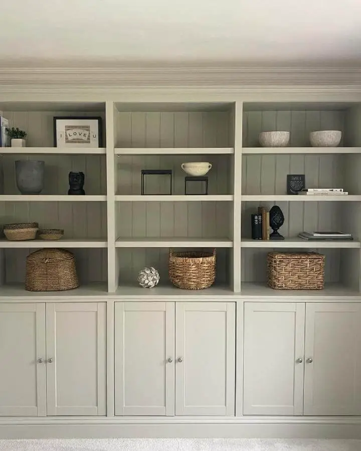 Sage green backed white cabinet showcasing ikea havsta hacks & ideas from @renovationrivendell with woven basket storage