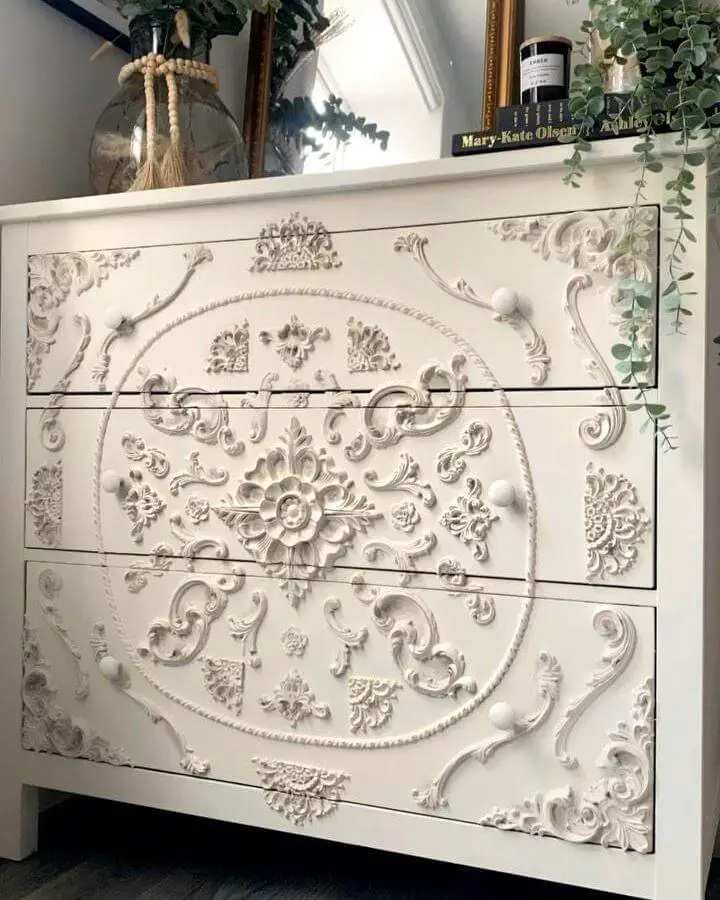 White ornate plaster applique Ikea Hemnes dresser inspired by @theflippedpiece with detailed vintage style decorations.