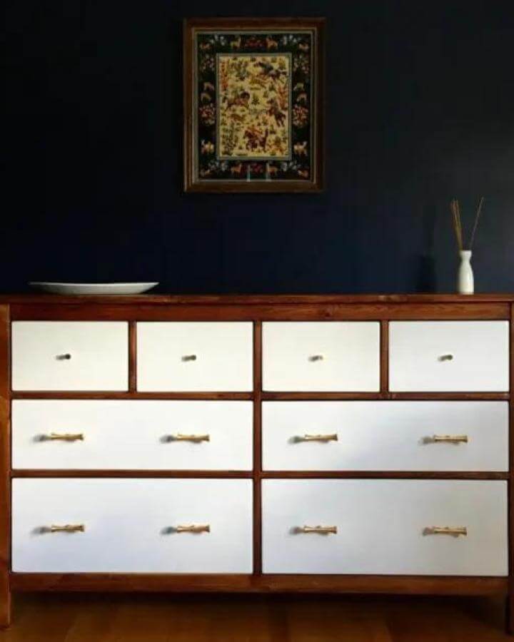 light wood and white painted Ikea Hemnes dresser with brass handles from Ikeahackers simple two-tone modernized furniture hack